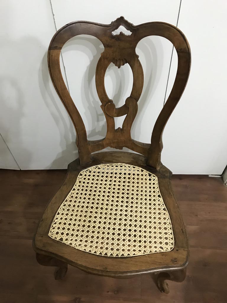 Urn back cane chair